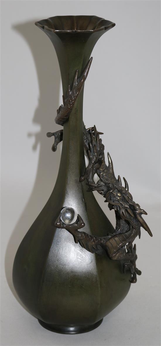 A Japanese bronze dragon hexagonal bottle vase, c.1880, 35.5cm